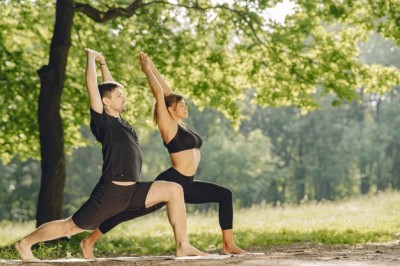 young-sportive-couple-doing-yoga-fitness-people-summer-park_1157-40151.jpg